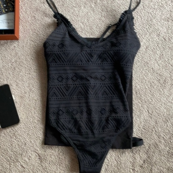 Black one piece with ruffling around top - Picture 1 of 4